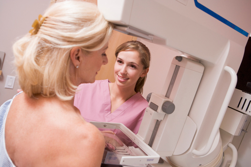 elderly woman getting a mammogram